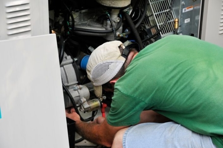 Technician working on generator
