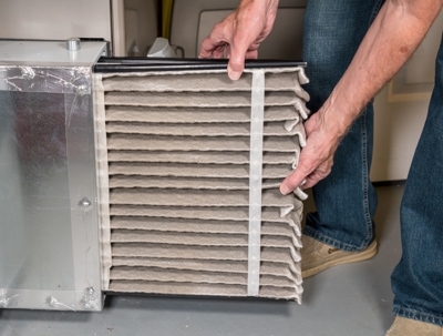 How do I change the air filter on my AC unit?